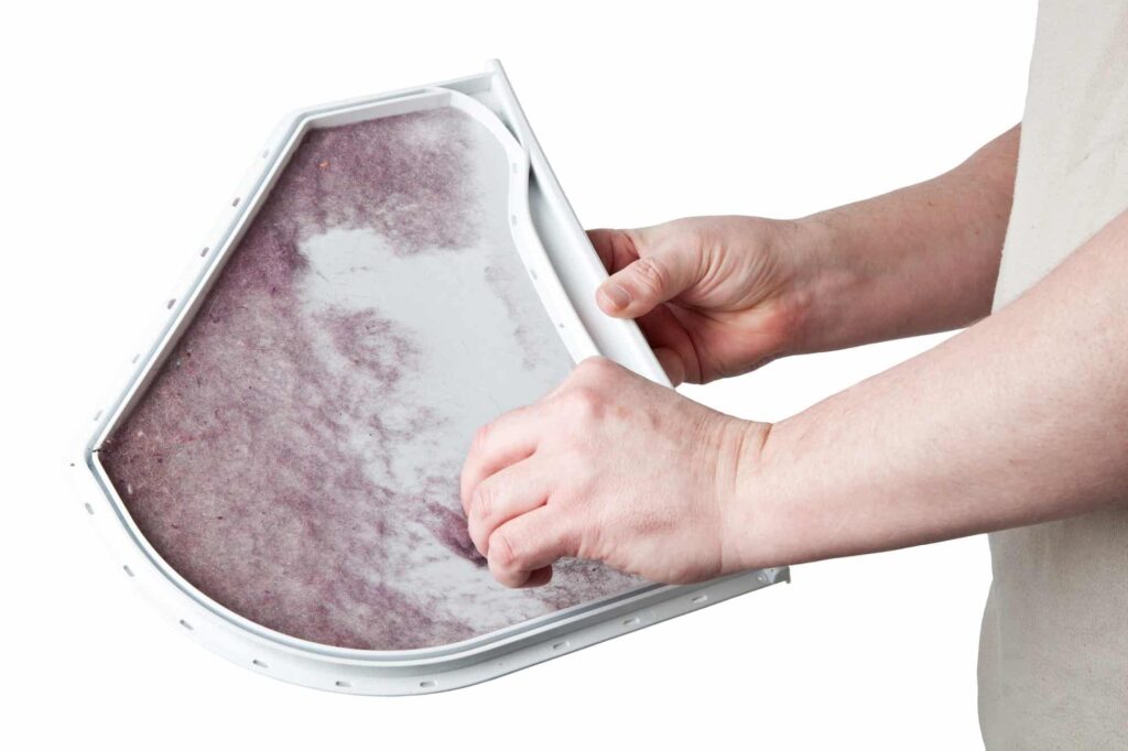 cleaning the lint from a dryer's lint trap
