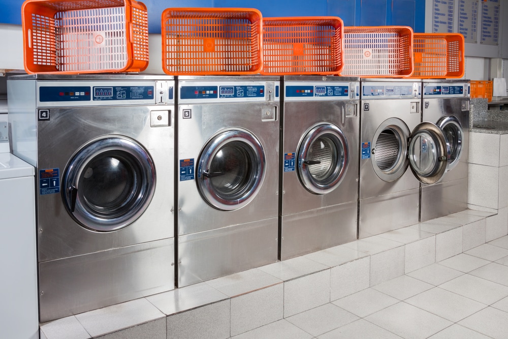 Laundromat, washers with baskets atop, clean and neat